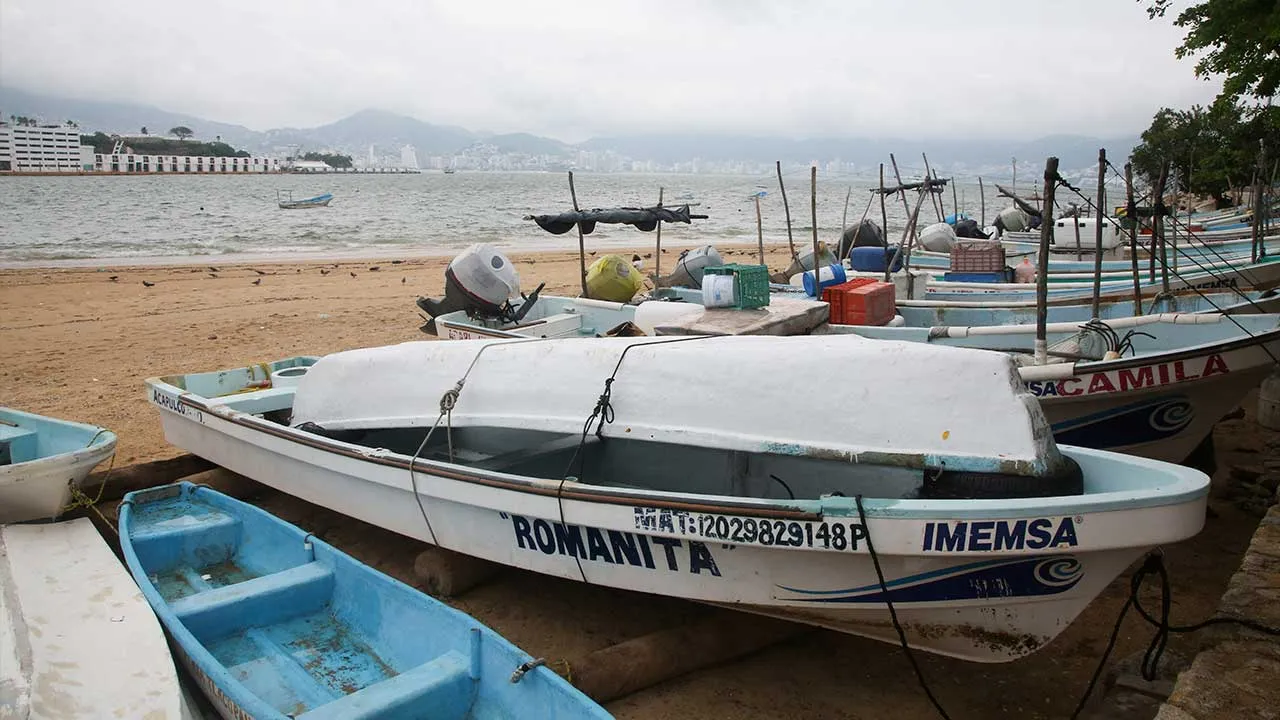 Fishing boats rest on the sand after being pulled from the sea as Hurricane Trudy moves parallel to Mexico's Pacific coast, threatening more rain and strong winds after recent deadly storms, in Acapulco, Mexico, October 15, 2026. REUTERS/Javier Verdin