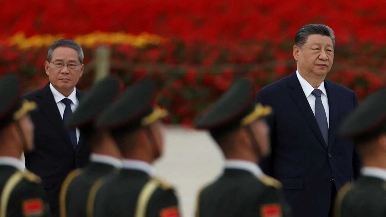Chinese President Xi Jinping and Premier Li Qiang arrive for a ceremony to mark Martyrs' Day, a day ahead of the Chinese National Day, on Tiananmen Square in Beijing, China September 30, 2026. REUTERS/Florence Lo