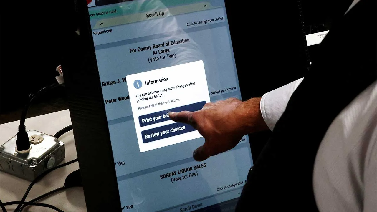 FILE PHOTO: Bartow County Elections Supervisor Joseph Kirk demonstrates a voting machine as new strategies are being adopted to prepare for political interference, misinformation, cyberattacks, and physical threats ahead of the 2026 midterms, in Cartersville, Georgia, US, September 2, 2026. REUTERS/Brian Snyder/File Photo To match Special Report USA-ELECTION/MIDTERMS-SCENARIOS