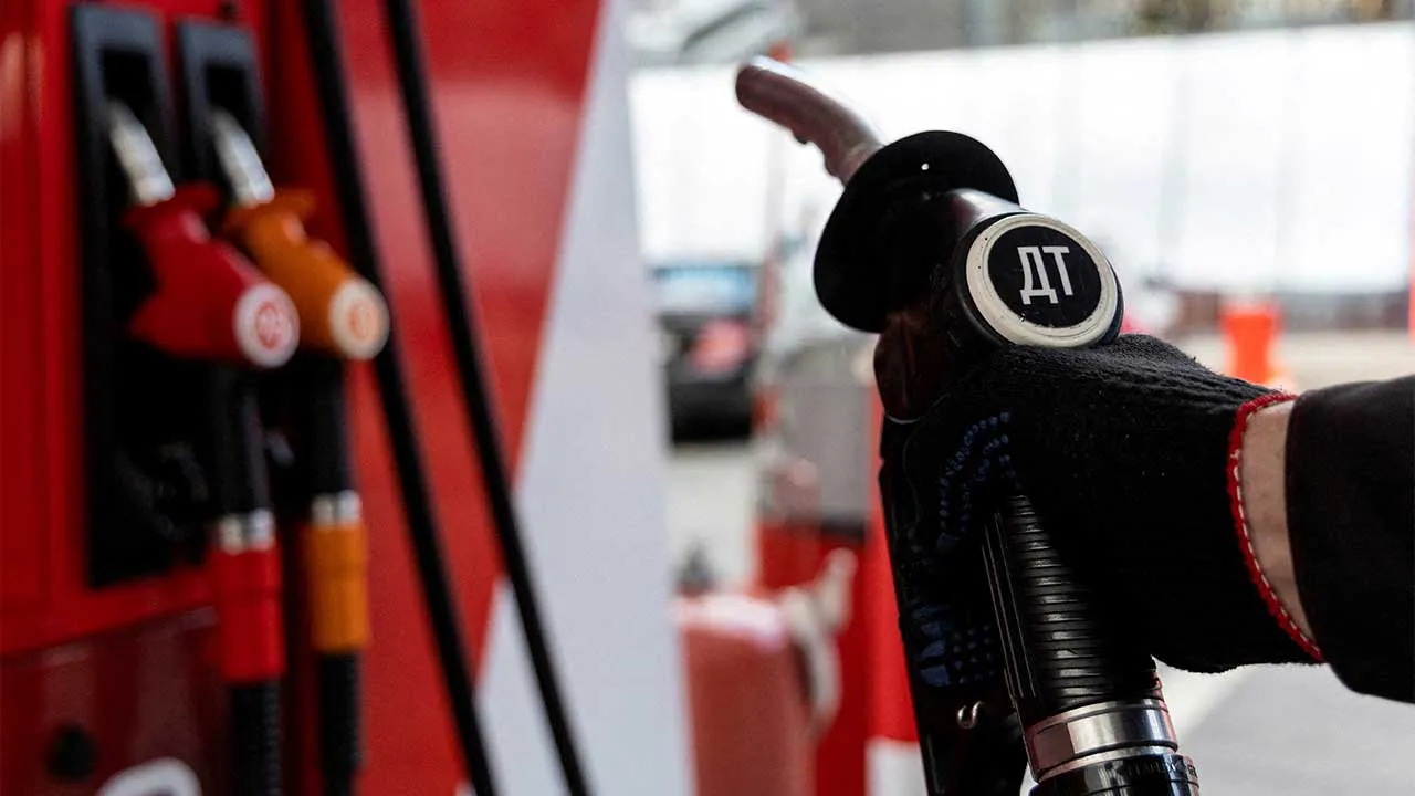 FILE PHOTO: An employee holds a diesel fuel pump nozzle at a petrol station of Neftmagistral company in Moscow, Russia, September 8, 2023. REUTERS/Maxim Shemetov/File Photo
