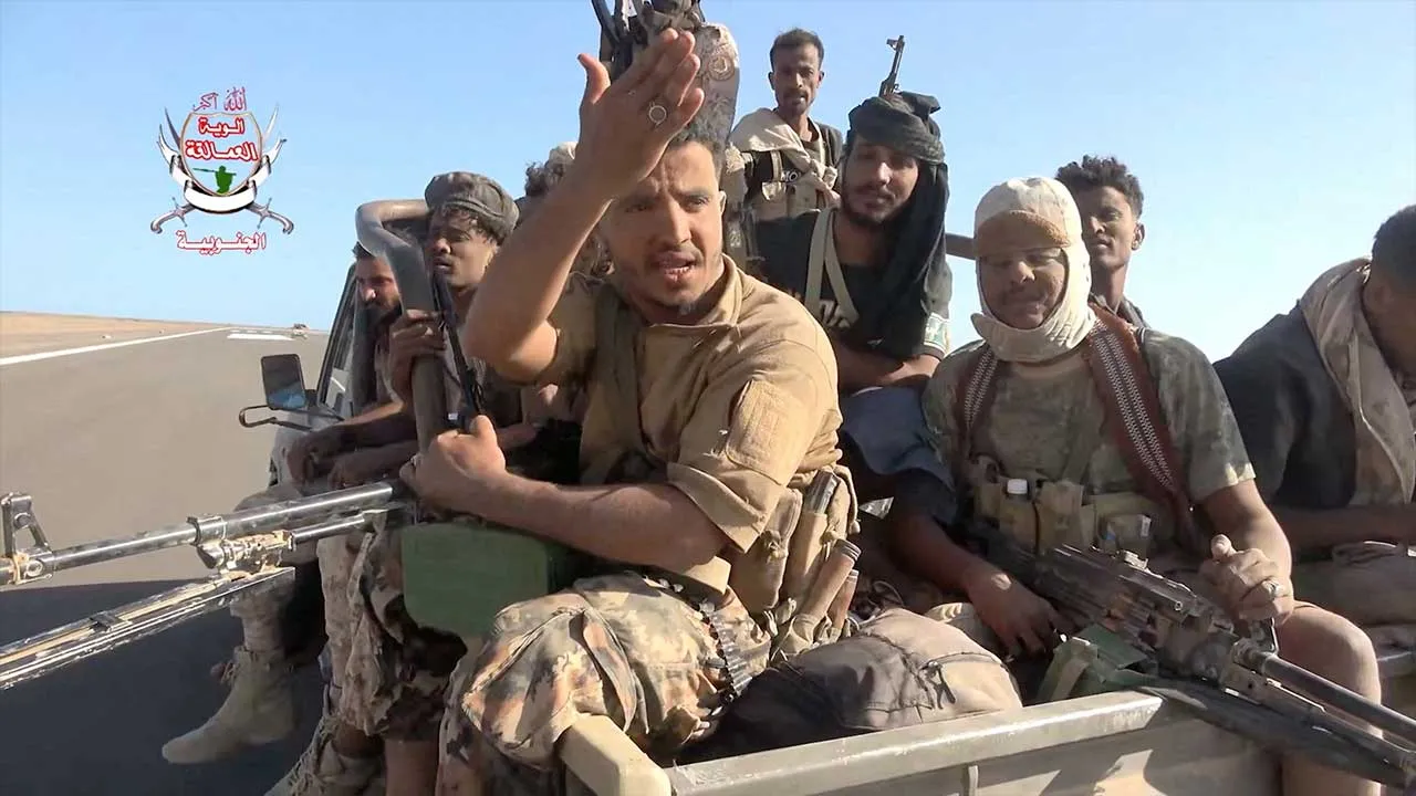 Pro-Saudi-backed Yemeni government fighters sit in the back of a vehicle during what government forces say was an advance against the Iran-backed Houthis, near Dhubab, Taiz Governorate, Yemen, in this still image taken from video released October 5, 2026. Southern Giants Brigades/Handout via REUTERS THIS IMAGE HAS BEEN SUPPLIED BY A THIRD PARTY. MUST NOT OBSCURE LOGO. VERIFICATION: - Location partially verified from the runway, airport control tower, road layout, shape of the mountains and coastline, that m