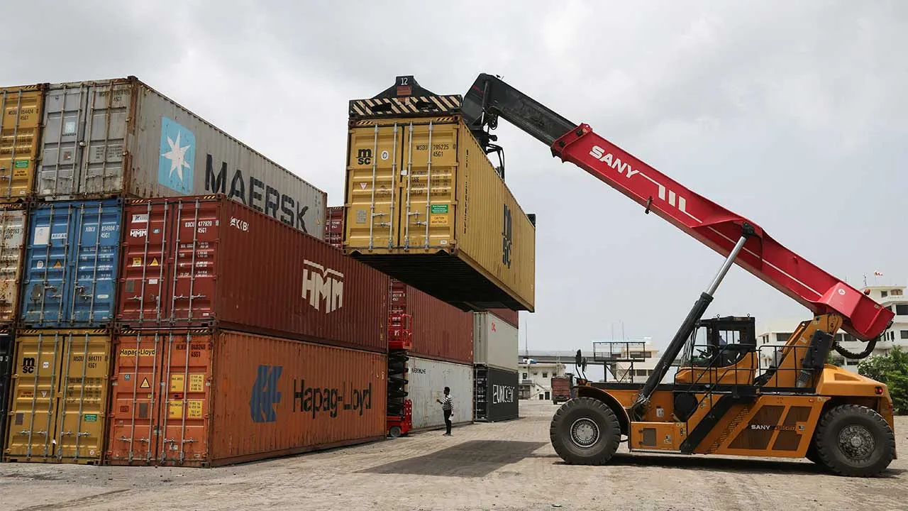 FILE PHOTO: A mobile crane carries a container to stack at Thar Dry Port in Sanand in the western state of Gujarat, India, July 15, 2026. REUTERS/Amit Dave/File Photo