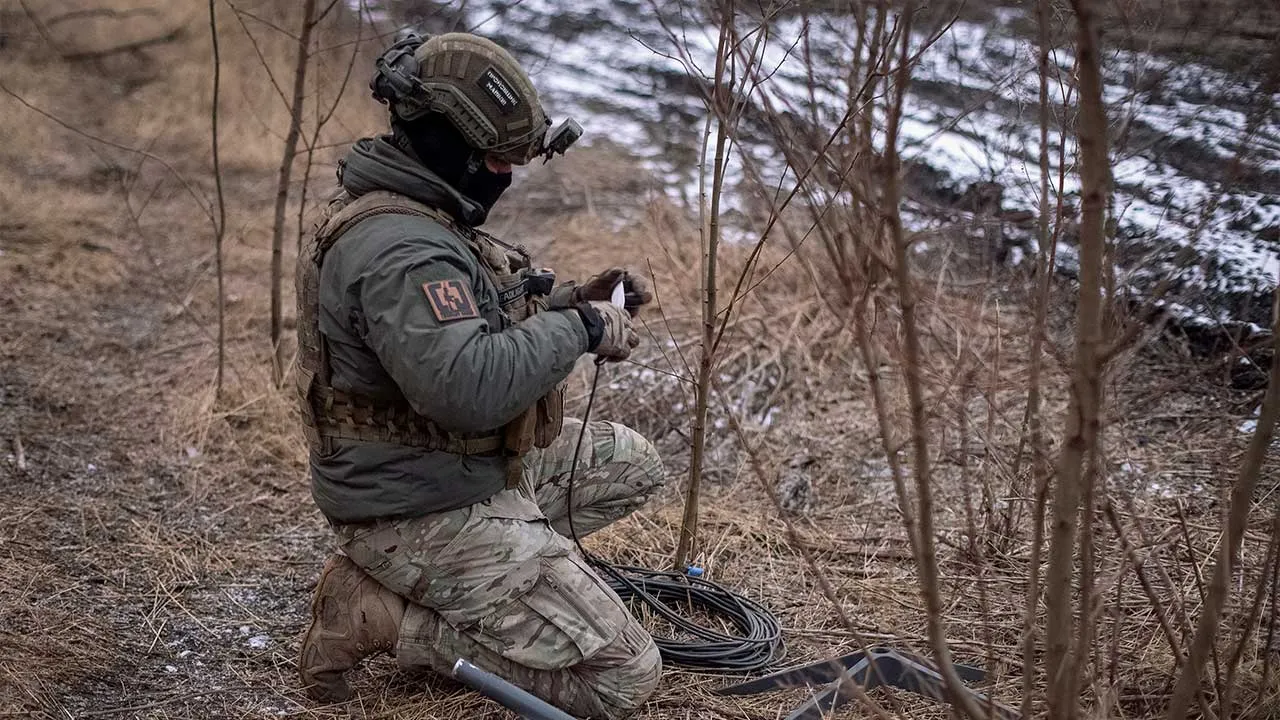 FILE PHOTO: A Ukrainian serviceman of 47th brigade prepares a Starlink satellite internet systems at his positions at a front line, amid Russia's attack on Ukraine, near the town of Avdiivka, recently captured by Russian troops in Donetsk region, Ukraine February 20, 2024. REUTERS/Inna Varenytsia/File Photo