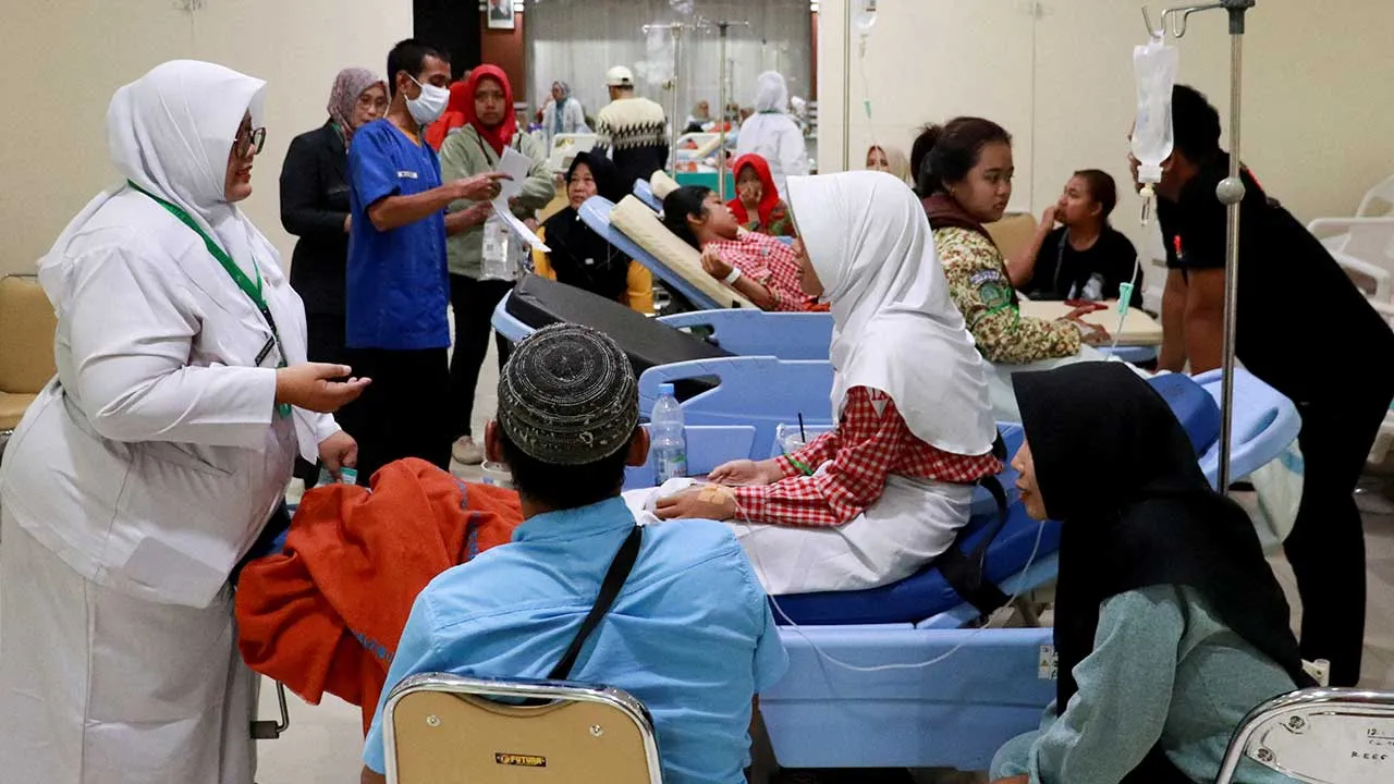 FILE PHOTO: Students rest while receiving treatment for food poisoning at the regional general hospital after eating government-sponsored free school meals in Pati, Central Java province, Indonesia, September 9, 2026. REUTERS/Ragil Kuswanto/File Photo