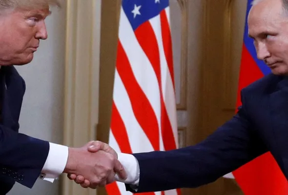 U.S. President Donald Trump and Russia's President Vladimir Putin shake hands as they meet in Helsinki, Finland July 16, 2018. REUTERS/Kevin Lamarque/File Photo