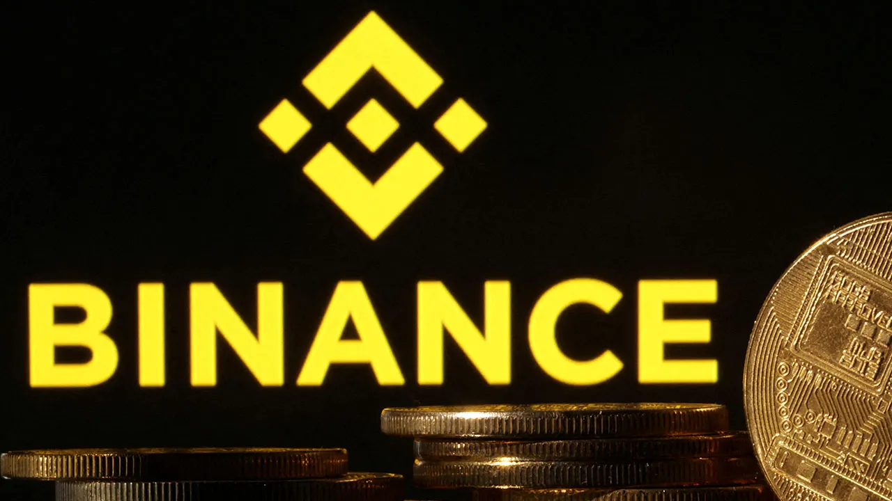 FILE PHOTO: Representations of cryptocurrencies are seen in front of displayed Binance logo in this illustration taken November 10, 2022. REUTERS/Dado Ruvic/Illustration/File Photo