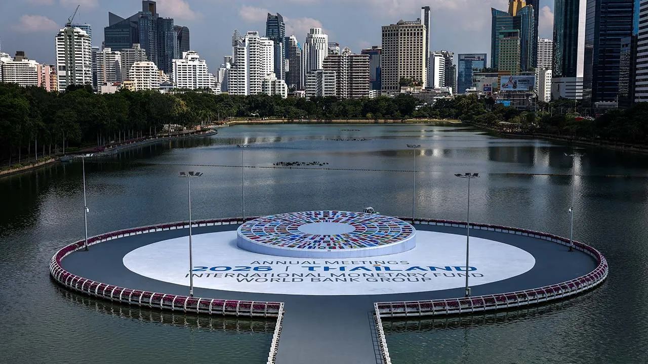 A worker cleans next to the logo of the 2026 IMF-World Bank Annual Meetings, ahead of the meeting at Queen Sirikit National Convention Center (QSNCC), in Bangkok, Thailand, October 9, 2026. REUTERS/Athit Perawongmetha