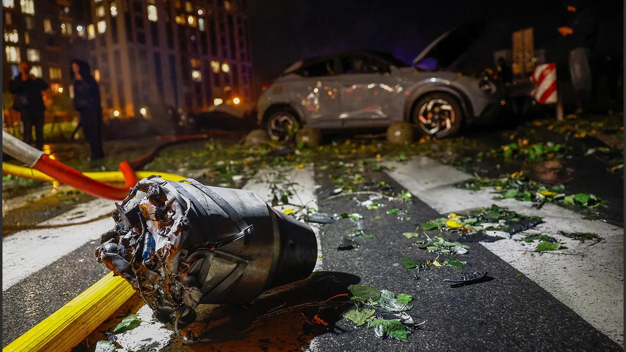 A jet engine of a Russian drone lies on the ground in a residential area damaged during a strike, amid Russia's attack on Ukraine, in Kyiv, Ukraine, October 12, 2026. REUTERS/Valentyn Ogirenko