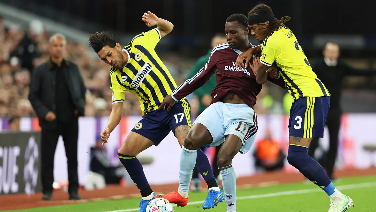 Fenerbahce's Archie Brown, right, and Fenerbahce's Irfan Kahveci challenge Aston Villa's Nicolas Jackson, center, during the Champions League opening phase soccer match between Aston Villa and Fenerbahce in Birmingham, England, Wednesday Oct. 14, 2026. (AP Photo/Morgan Harlow)