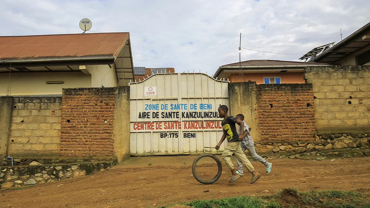 Children play outside a health center amidst an outbreak of the Ebola virus, in Beni, North Kivu province, eastern Congo, Friday, Oct. 16, 2026. (AP Photo/Sebastien Kitsa Musayi)