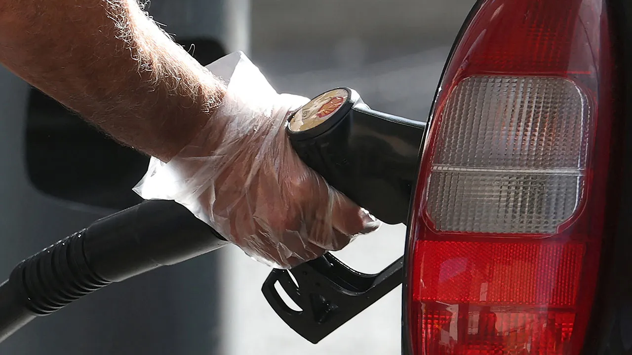 A motorist fills a vehicle with diesel fuel at a petrol station in London, Britain, October 2, 2026. The average pump price of a litre of diesel fuel hit £2 ($2.64) in Britain for the first time on Friday, according to data compiled by the RAC motoring organisation, the latest landmark in a global surge in fuel prices. REUTERS/Toby Melville