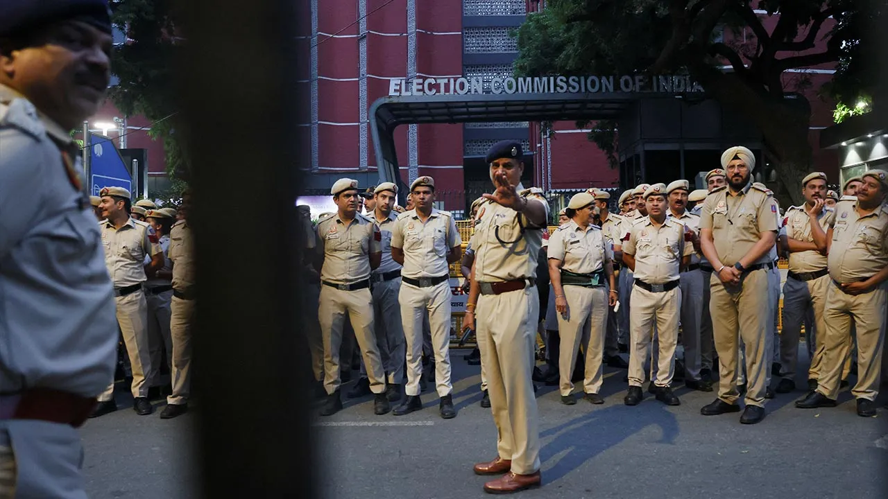 Security personnel stand guard outside the headquarters of the Election Commission of India on the day of a Cockroach Janta Party (CJP) protest seeking the resignation of India's Chief Election Commissioner, Gyanesh Kumar, in New Delhi, India, October 10, 2026. REUTERS/Bhawika Chhabra