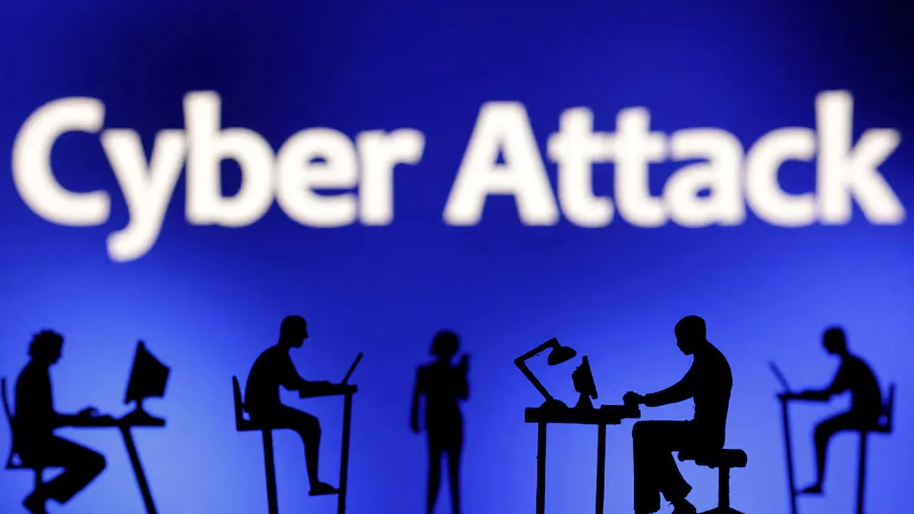 Figurines with computers and smartphones are seen in front of the words "Cyber Attack" in this illustration taken, February 19, 2024. REUTERS/Dado Ruvic/Illustration