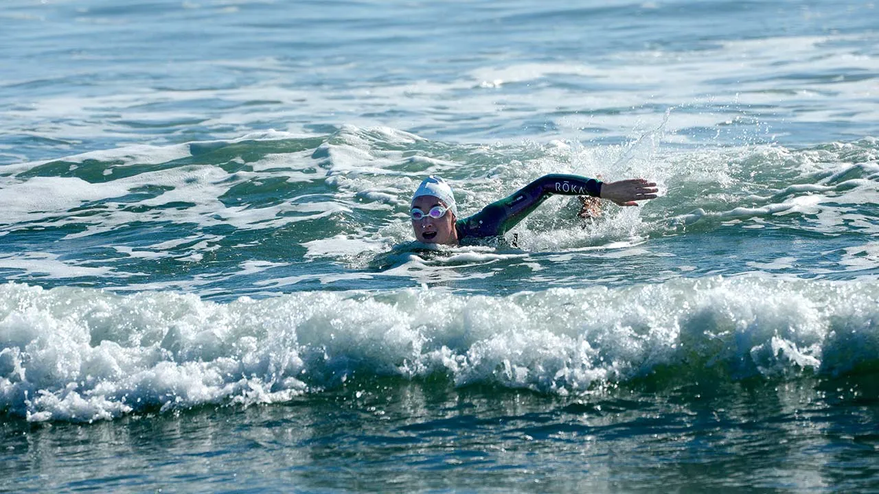 Catherine Breed reaches the beach at Coronado, completing nearly 900 miles swim, on Monday, Oct. 19, 2026, in Coronado, Calif. (Nelvin C. Cepeda/The San Diego Union-Tribune via AP)