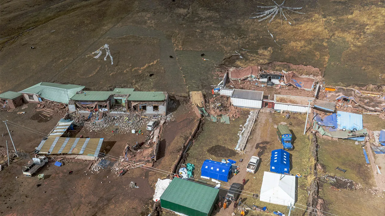 In this photo released by Xinhua News Agency, an aerial drone photo show damaged houses after a powerful earthquake hit in Nagqu in southwest China's Tibet autonomous region, Friday, Oct. 23, 2026. (Tenzin Nyida/Xinhua via AP)