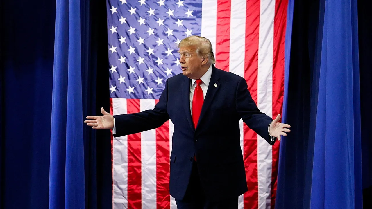 US President Donald Trump reacts as he walks on stage at the Curtis D. Menard Memorial Sports Center in Wasilla, Alaska, US, October 13, 2026. REUTERS