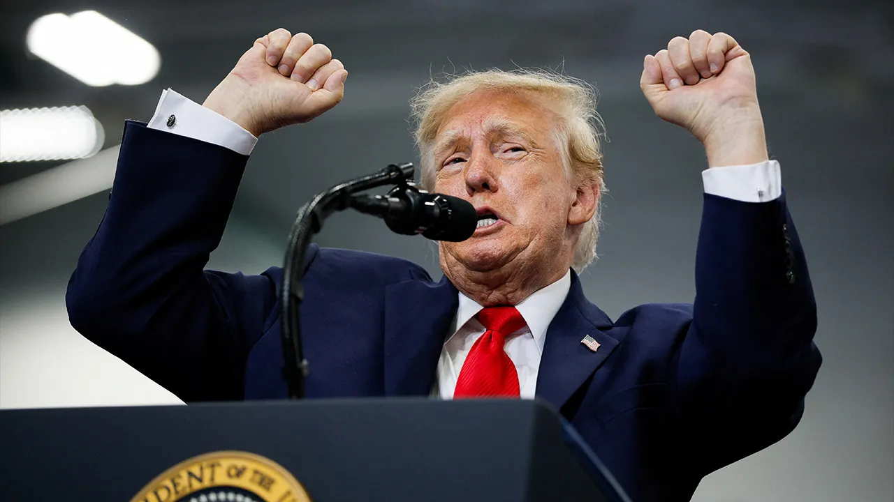 US President Donald Trump gestures on stage as he speaks at the Curtis D. Menard Memorial Sports Center in Wasilla, Alaska, US, October 13, 2026. REUTERS
