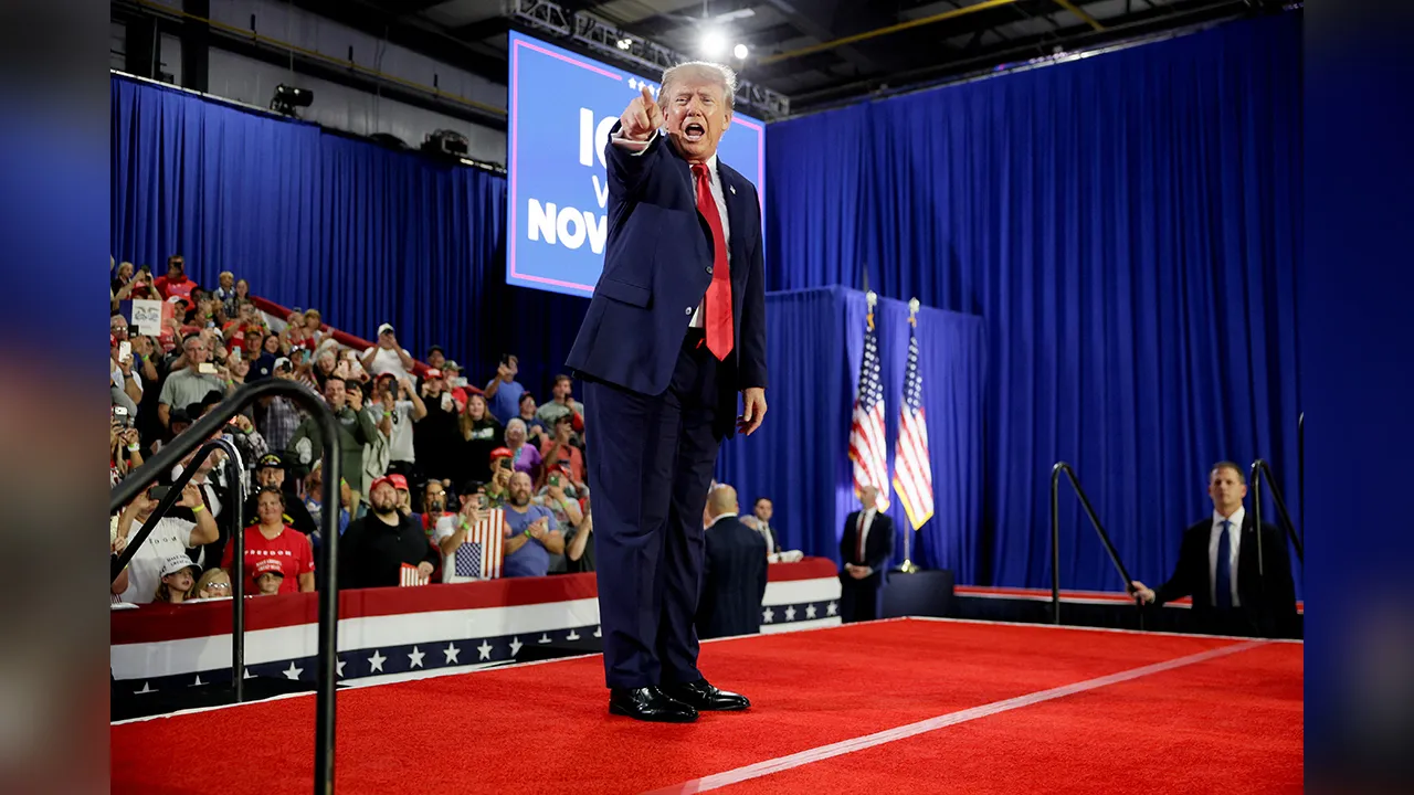 US President Donald Trump points on stage during a Republican campaign rally in Sioux City, Iowa, US, October 22, 2026. REUTERS/Evan Vucci