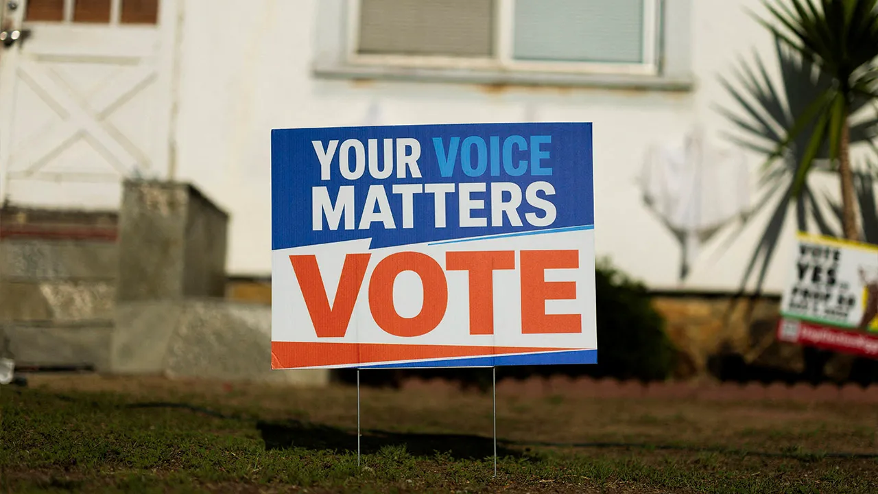 An election sign encouraging people to vote is displayed in the front yard of a residential home in Encinitas, California, US, October 21, 2026. REUTERS/Mike Blake/File Photo