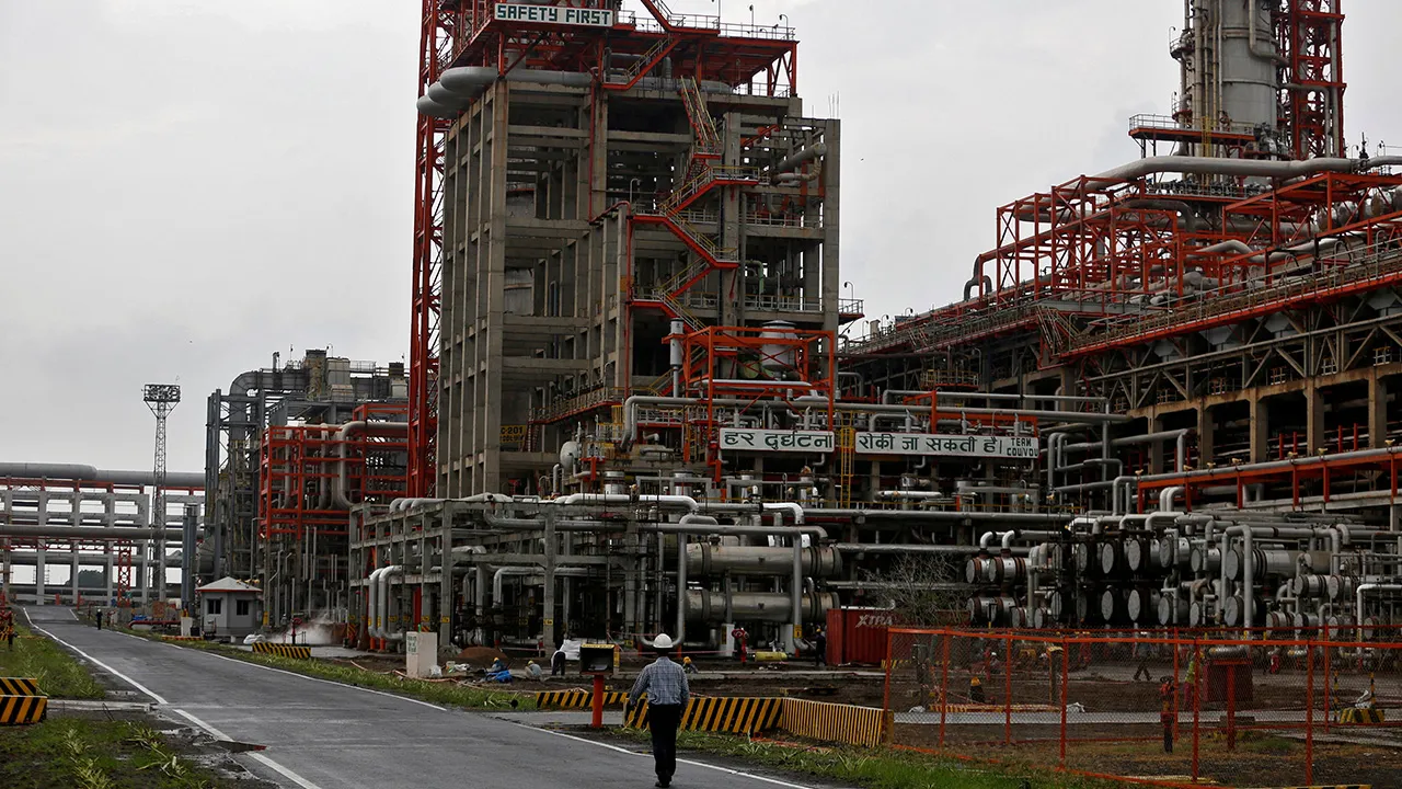 An employee walks inside the premises of an oil refinery of Essar Oil, which runs India's second biggest private sector refinery, in Vadinar in the western state of Gujarat, India, October 4, 2016. Picture taken October 4, 2016. REUTERS/Amit Dave