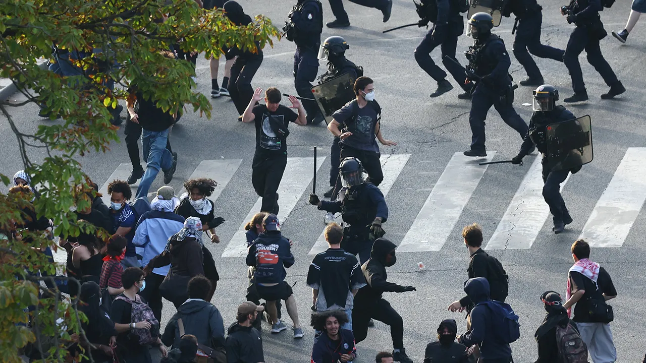 French CRS riot police charge protesters amid clashes at Place de la Nation during a demonstration by high school and university students, supported by teachers' union and school parents, in Paris as part of a nationwide day of demonstrations and blockades, voicing anger over overcrowded classrooms, teacher shortages and dilapidated school buildings, which students blame on years of underinvestment, France, October 6, 2026. REUTERS/Yves Herman