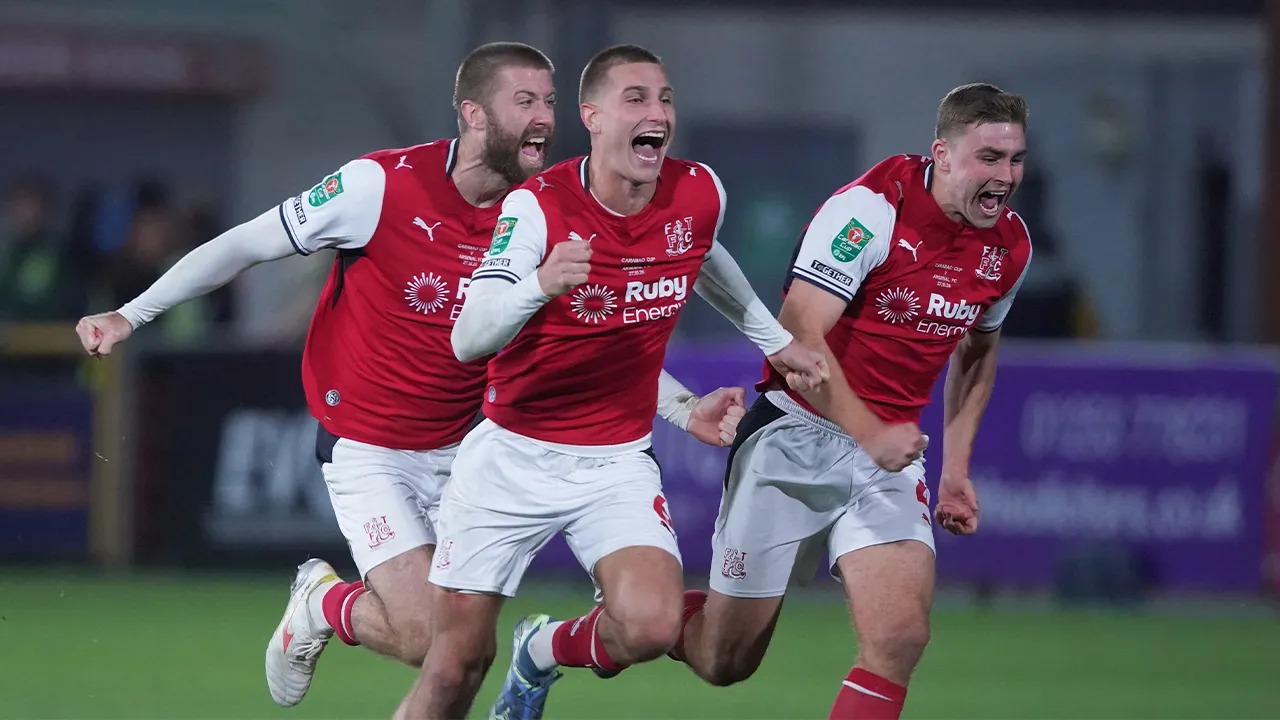 Fleetwood's players celebrate after winning a penalty shootout during the English League Cup soccer match between Fleetwood Town and Arsenal in Fleetwood, England, Tuesday, Oct. 27, 2026. (AP Photo/Ian Hodgson)
