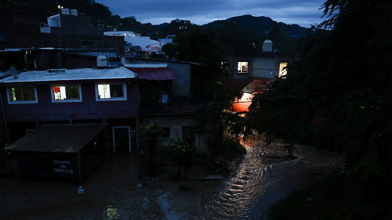 Floodwaters flow around buildings as Hurricane Simon approaches Mexico's Pacific coast in Costalegre, Jalisco state, Mexico, October 11, 2026. REUTERS/Daniel Becerril