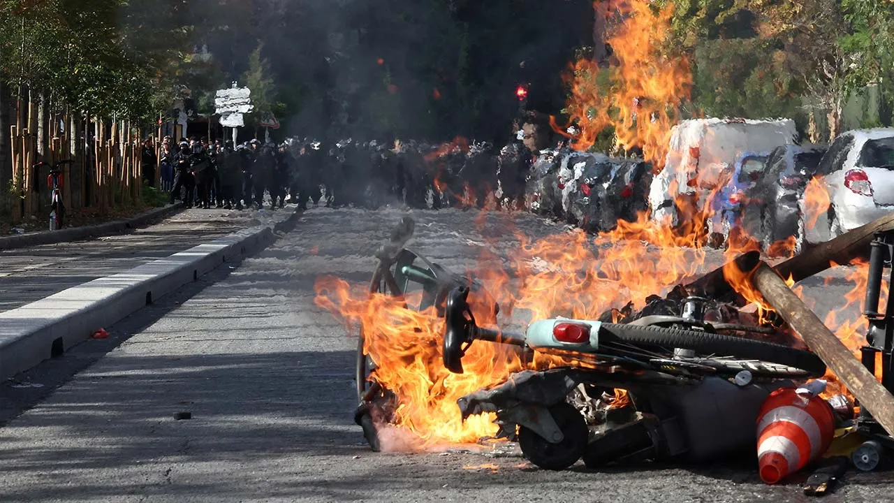 View of burning Velib bicycle, garbage bins and objects set up by high school and university students in a street amid clashes with French riot police during a student protest to demand the hiring of substitute teachers, increased resources and better learning conditions, and to support the ongoing high-school student movement in the Seine-Saint-Denis department, in Saint-Denis near Paris, France, October 1, 2026. REUTERS/Abdul Saboor