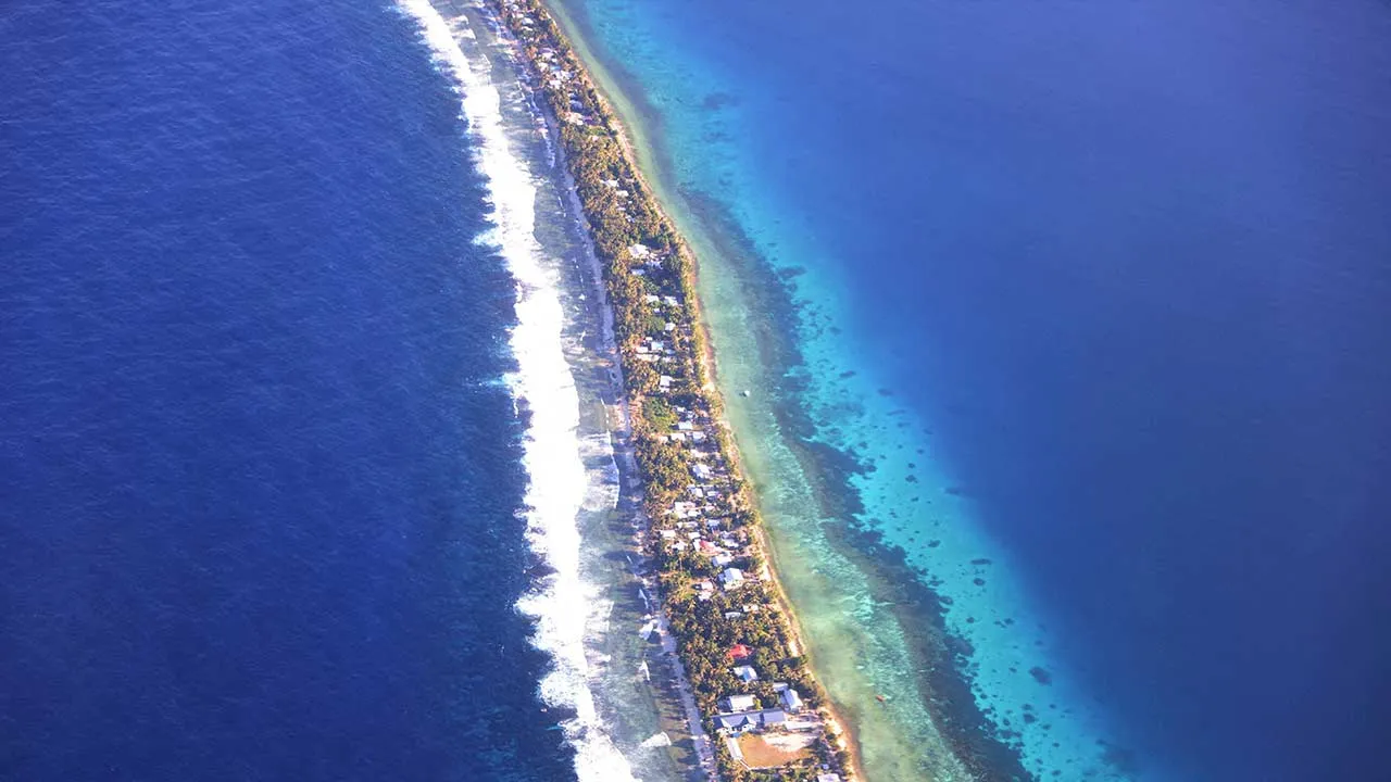 FILE PHOTO: Aerial view of Funafuti, Tuvalu’s most populous island, September 6, 2024. Picture taken through plane window. REUTERS/Kirsty Needham/File Photo