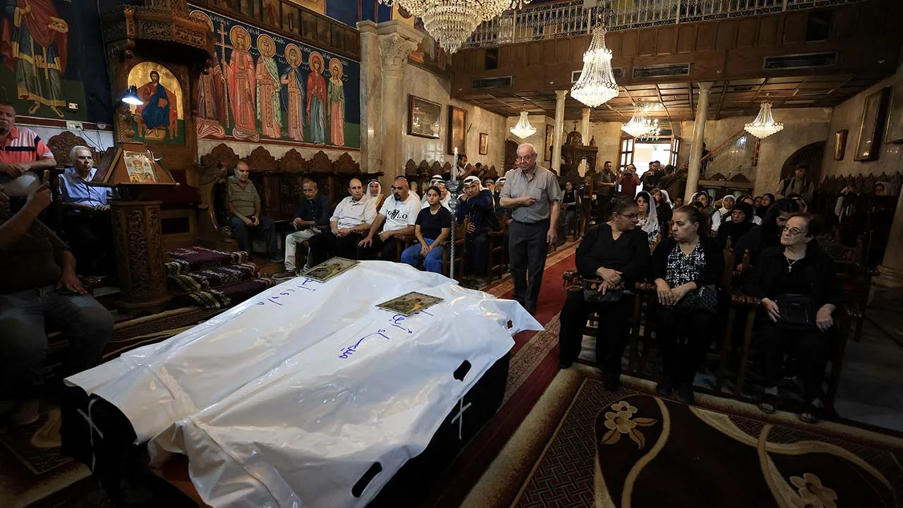 Mourners attend the funeral of Palestinian Orthodox Christians Mary Hafez Abu Daoud and her daughter Maysa Abu Daoud, who were killed in an Israeli airstrike on an apartment building, according to medics, at Saint Porphyrius Church, in Gaza City, October 3, 2026. REUTERS/Dawoud Abu Alkas