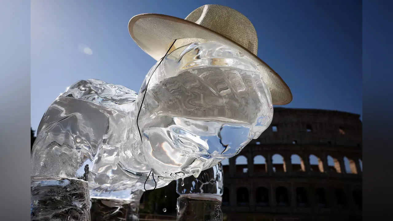 An ice statue depicting a famer, one of the groups of workers most vulnerable to heatwaves, placed by Greenpeace activists, melts under the sun, during a demonstration to highlight the impacts of global warming as a heatwave grips Italy, near the Colosseum, in Rome, Italy, July 15, 2026. REUTERS/Guglielmo Mangiapan