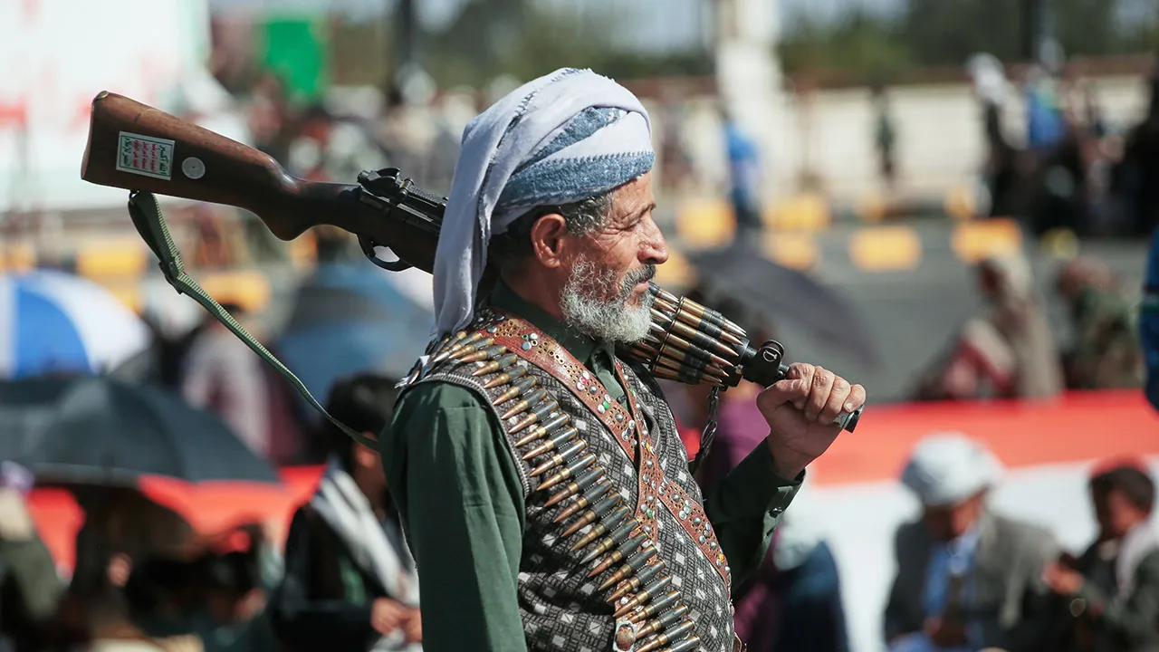 A supporter of Yemen's Houthi rebels carries his rifle during a rally in support of the group in Sanaa, Yemen, Friday, Oct. 9, 2026. (AP Photo/Osamah Abdulrahman)