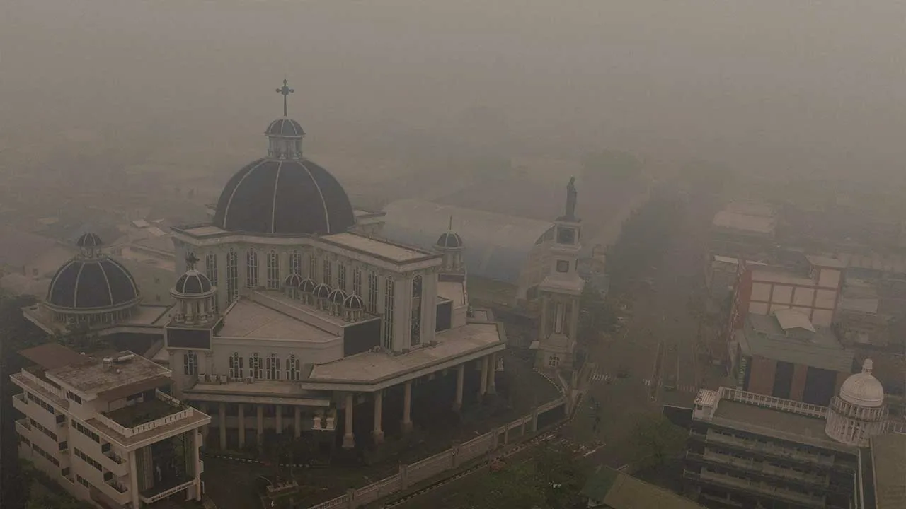 A drone view shows St. Joseph's Cathedral shrouded in haze from wildfires, in Pontianak, West Kalimantan province, Indonesia, September 15, 2026. REUTERS/Ajeng Dinar Ulfiana REFILE - ADDING THE NAME OF THE CATHEDRAL