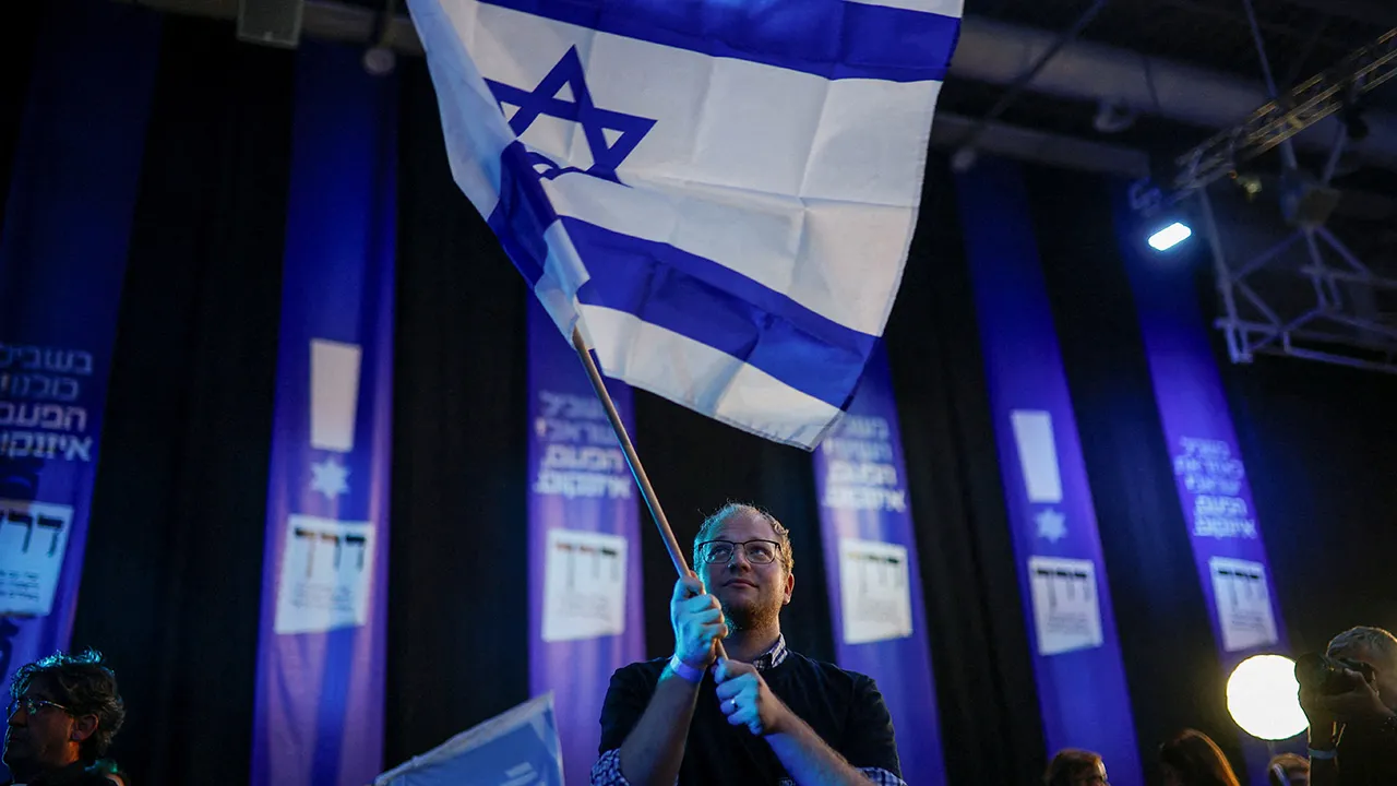 A supporter of former military chief Gadi Eisenkot, leader of the Yashar party, reacts to the exit poll at his party headquarters, on the evening of Israel's national election, in Tel Aviv, Israel October 27, 2026. REUTERS/Shir Torem