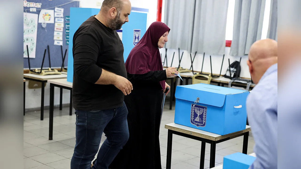 A woman votes during the national election in the Arab city of Umm al-Fahm, northern Israel, October 27, 2026. REUTERS/Ammar Awad