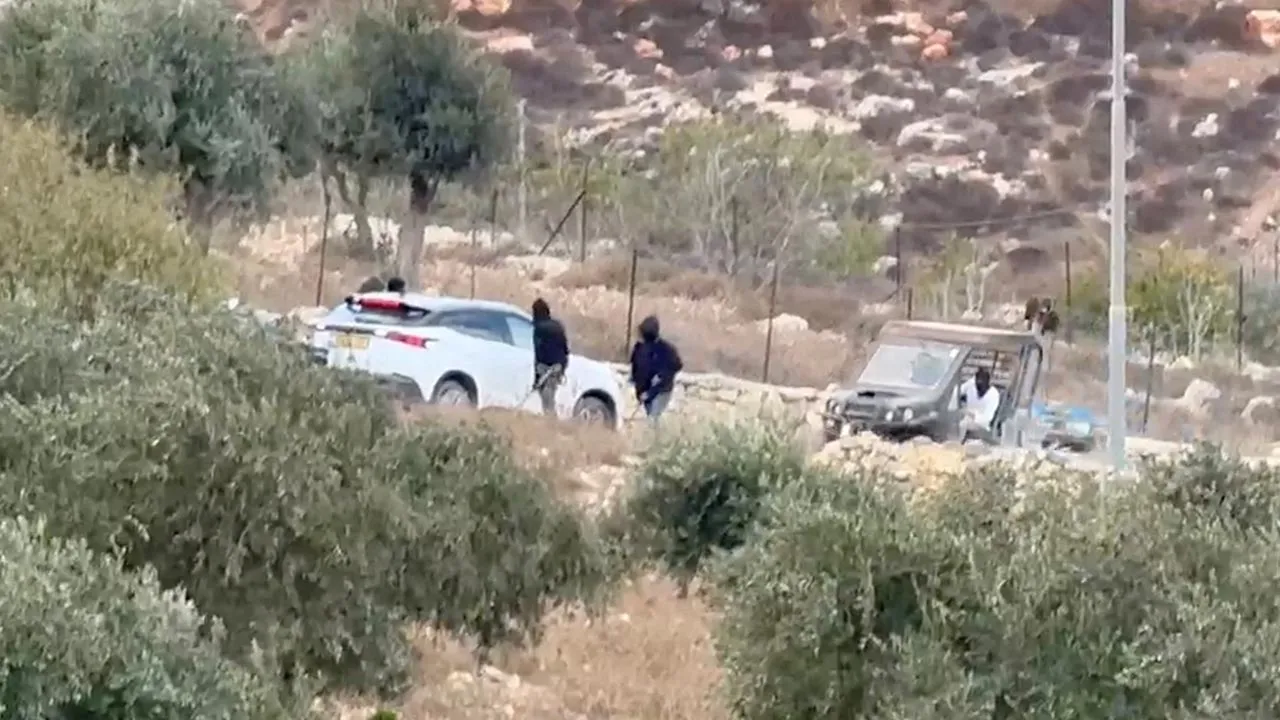 Vehicles at the site where Belgium's foreign minister says masked settlers in the Israeli-occupied West Bank attacked Palestinians, Catholic representatives and Western diplomats and officials, in Taybeh, in the Israeli-occupied West Bank, October 17, 2026. in this screengrab from a video obtained from social media. Emad Diab/via REUTERS