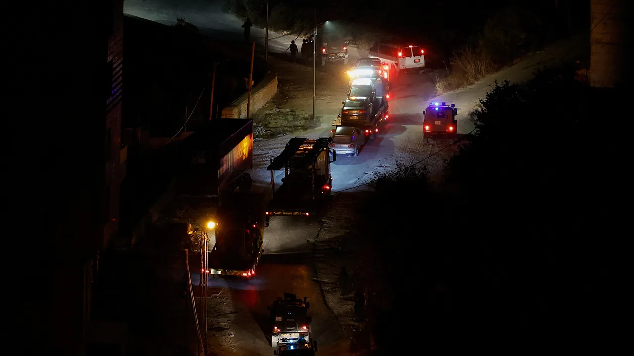 Israeli forces take Palestinian cars during a military operation in Hebron, in the Israeli-occupied West Bank October 25,2026. REUTERS/Mussa Qawasma