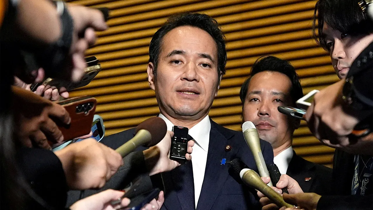 Japan's Minister for Agriculture, Forestry and Fisheries Kazuo Yana speaks to media after expressing his intention to resign to the Prime Minister Sanae Takaichi at Takaichi's official residence in Tokyo, Japan October 14, 2026, in this photo taken by Kyodo. Kyodo/via REUTERS