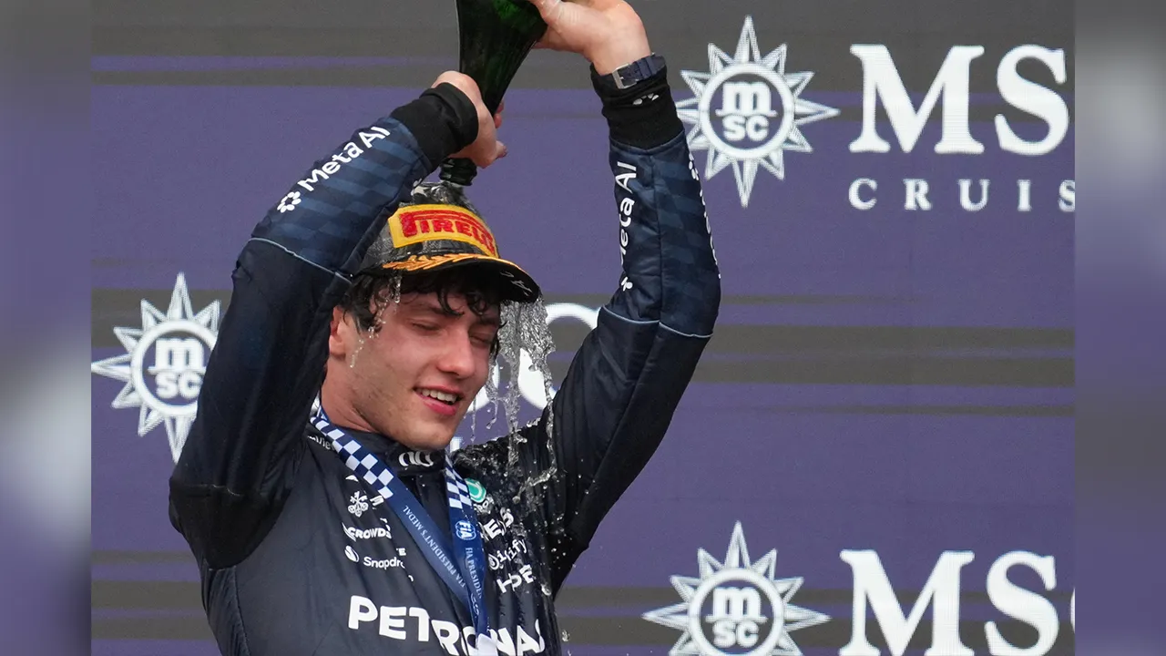 Mercedes driver Andrea Kimi Antonelli of Italy celebrates on the podium after winning the Formula One U.S. Grand Prix auto race in Austin, Texas, Sunday, Oct. 25, 2026. (AP Photo/Eric Gay)