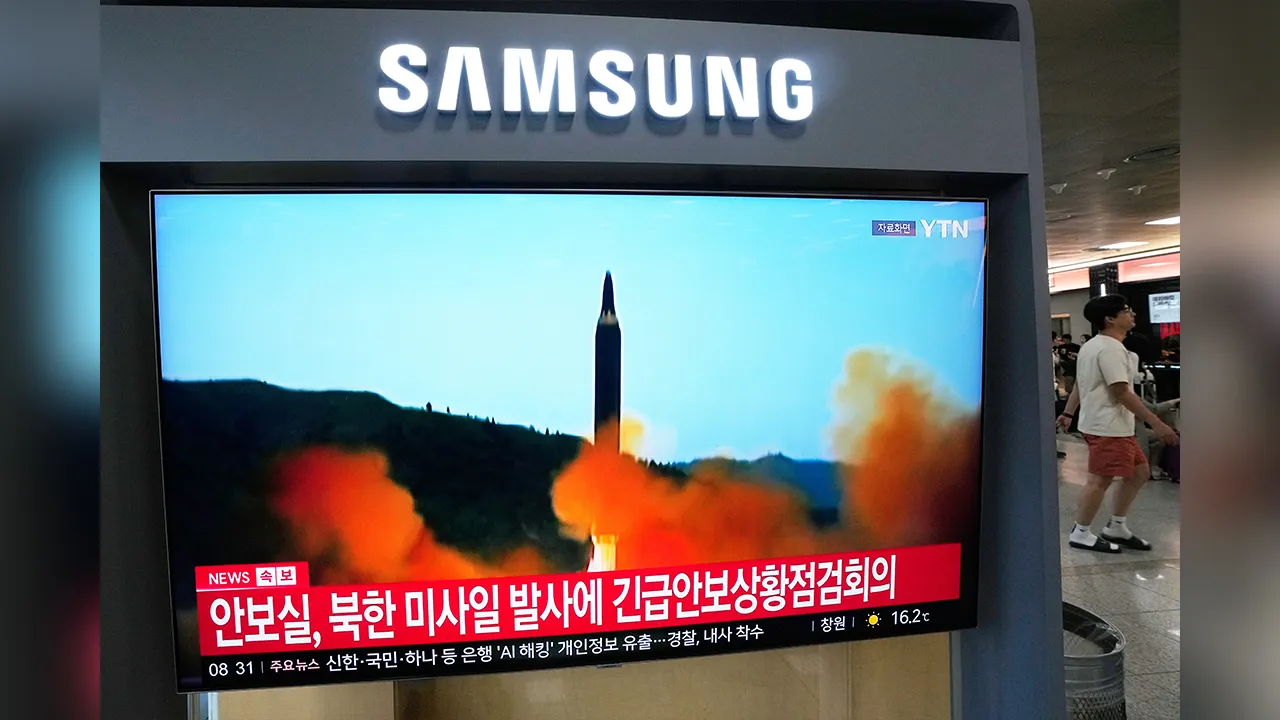 A TV screen shows a file image of a North Korean missile launch during a news program at Seoul Railway Station in Seoul, South Korea, Saturday, Oct. 3, 2026. (AP Photo/Ahn Young-joon)