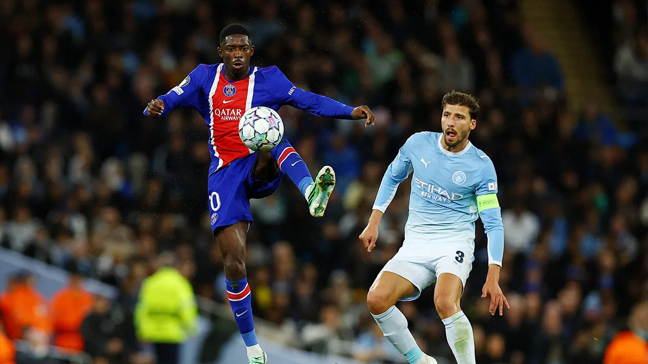 Soccer Football - UEFA Champions League - Manchester City v Paris St Germain - Etihad Stadium, Manchester, Britain - October 14, 2026 Paris St Germain's Ousmane Dembele in action with Manchester City's Ruben Dias REUTERS/Phil Noble