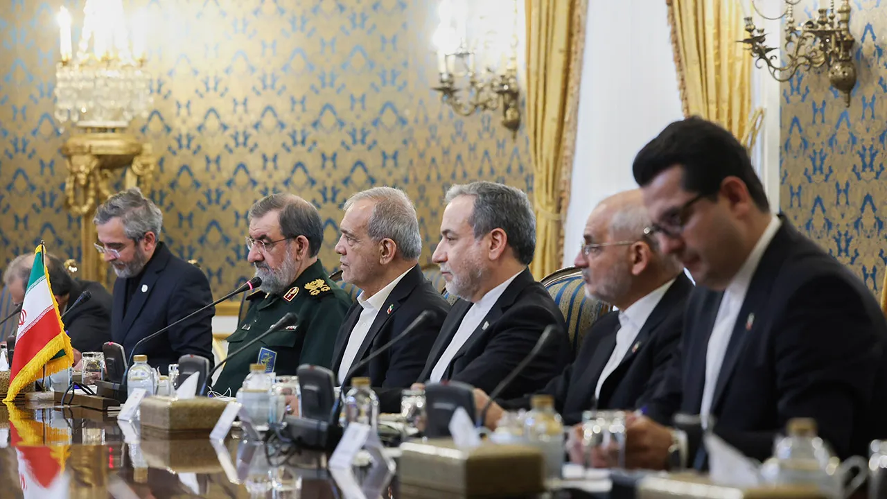 In this photo released by the Iranian Presidency Office, Iran's President Masoud Pezeshkian, third left, attends a meeting with high-level delegations from Saudi Arabia, Pakistan and Turkey, as the secretary of Iran's Supreme National Security Council Mohsen Rezaei, second left, and Foreign Minister Abbas Araghchi, third right, listen in Tehran, Iran, Monday, Oct. 26, 2026. (Iranian Presidency Office via AP)