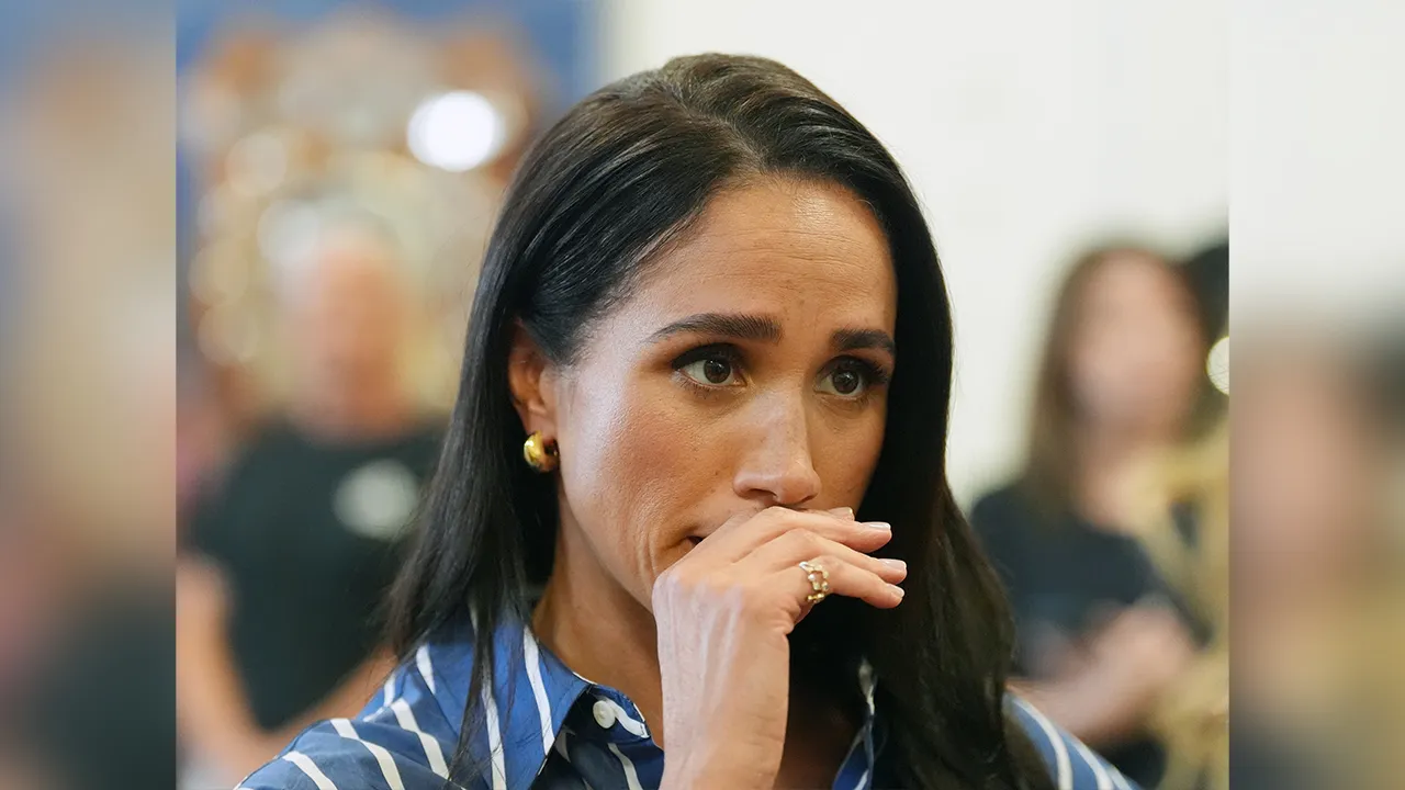 FILE- Meghan Markle, the Duchess of Sussex, meets volunteer first responders from the Bondi Surf Bathers' Life Saving Club during a visit to Bondi Beach, Australia, on April 17, 2026. (Jonathan Brady/Pool Photo via AP, File)