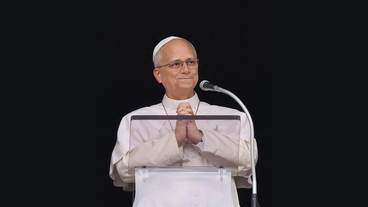 Pope Leo gestures, as he leads the Angelus prayer from a window of the Apostolic Palace, following his discharge from hospital after surgery for lung cancer, at the Vatican, October 18, 2026. REUTERS/Yara Nardi