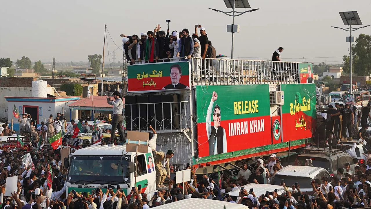 Supporters of imprisoned former Prime Minister Imran Khan's party prepare to march demanding Khan's release, in Lakki Marwat, a remote town in northwestern Pakistan, Sunday, Oct. 4, 2026. (AP Photo/Maaz Awan)