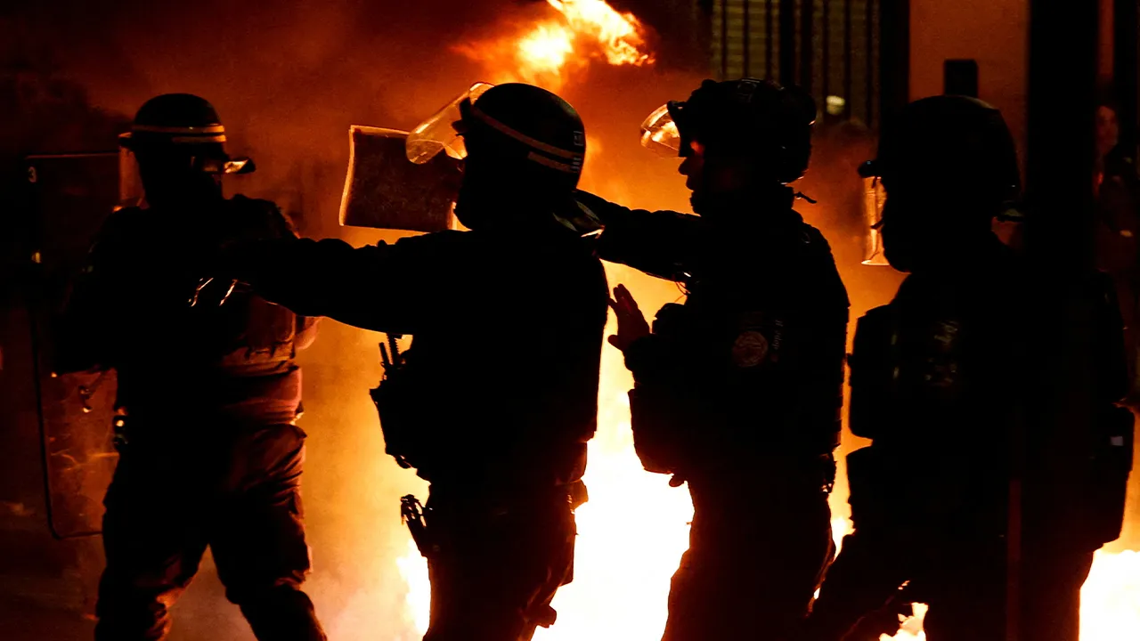FILE PHOTO: French police operate during a demonstration following a special address to the nation by French President Emmanuel Macron, after he signed into law the pension reform raising the retirement age, in Paris, France, April 17, 2023. REUTERS/Stephanie Lecocq/File Photo