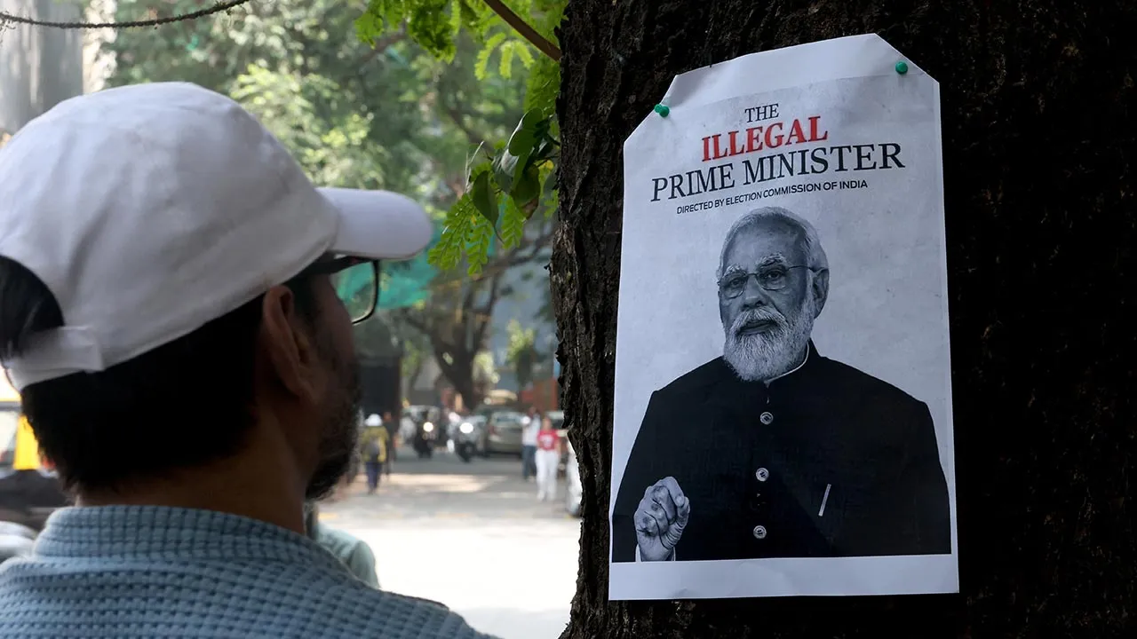 A man looks at a poster pinned to a tree outside Shivaji Park ahead of a protest by the Cockroach Janta Party (CJP) demanding the resignation of India's Chief Election Commissioner Gyanesh Kumar, in Mumbai, India, October 2, 2026. REUTERS/Priyanshu Singh