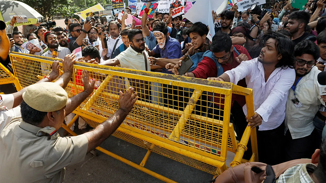Demonstrators push against a police barricade during a protest demanding the resignation of India's Chief Election Commissioner Gyanesh Kumar, in New Delhi, India, October 3, 2026. REUTERS