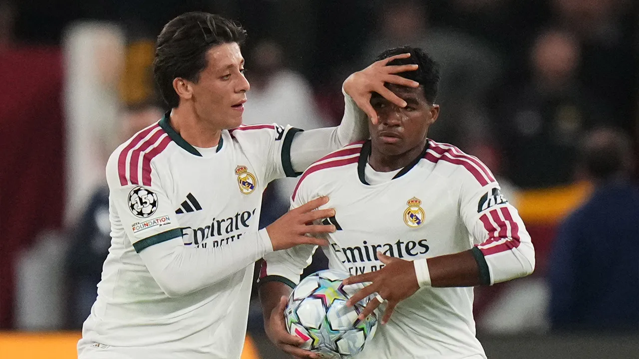 Real Madrid's Endrick celebrates with his teammate Arda Guler after scoring his side's third gola during a Champions League opening phase soccer match between Roma and Real Madrid, in Rome, Wednesday, Oct.14, 2026. (AP Photo/Alessandra Tarantino)