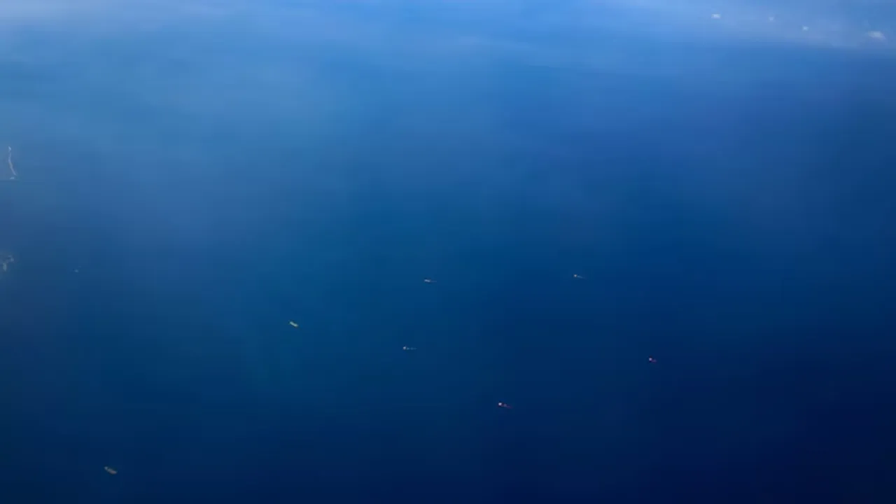 An aerial view shows ships on the Red Sea near the coast, as pictured through the window of a plane, February 6, 2025. REUTERS/Amr Abdallah Dalsh
